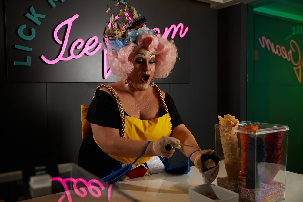 Drag host serving ice cream on board