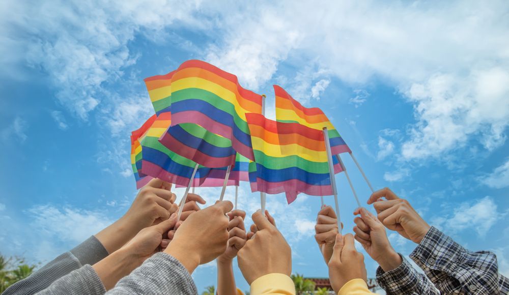 Pride flags raised to the sky